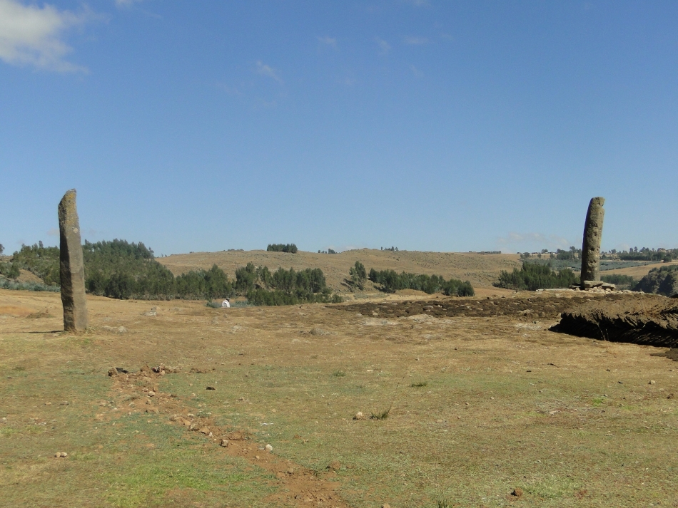 Qum Dengay, Debre Berhan. These two stelae are the tallest from among dozens of monoliths documented in the Central highlands region of Ethiopia. They were first documented by Paul Soleillet in the 1880s and by Francis Anfray a century later. 